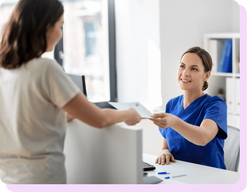 nurse handing over documents to a patient over the table on carolside case study page